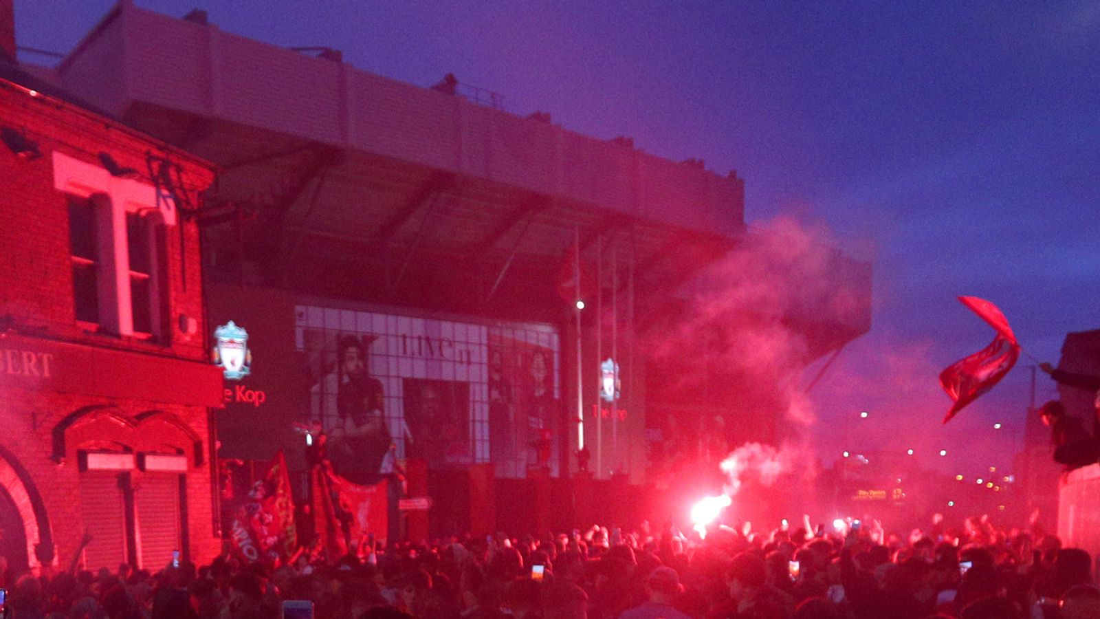 Nine arrested as Liverpool fans defy police warnings to gather at Anfield