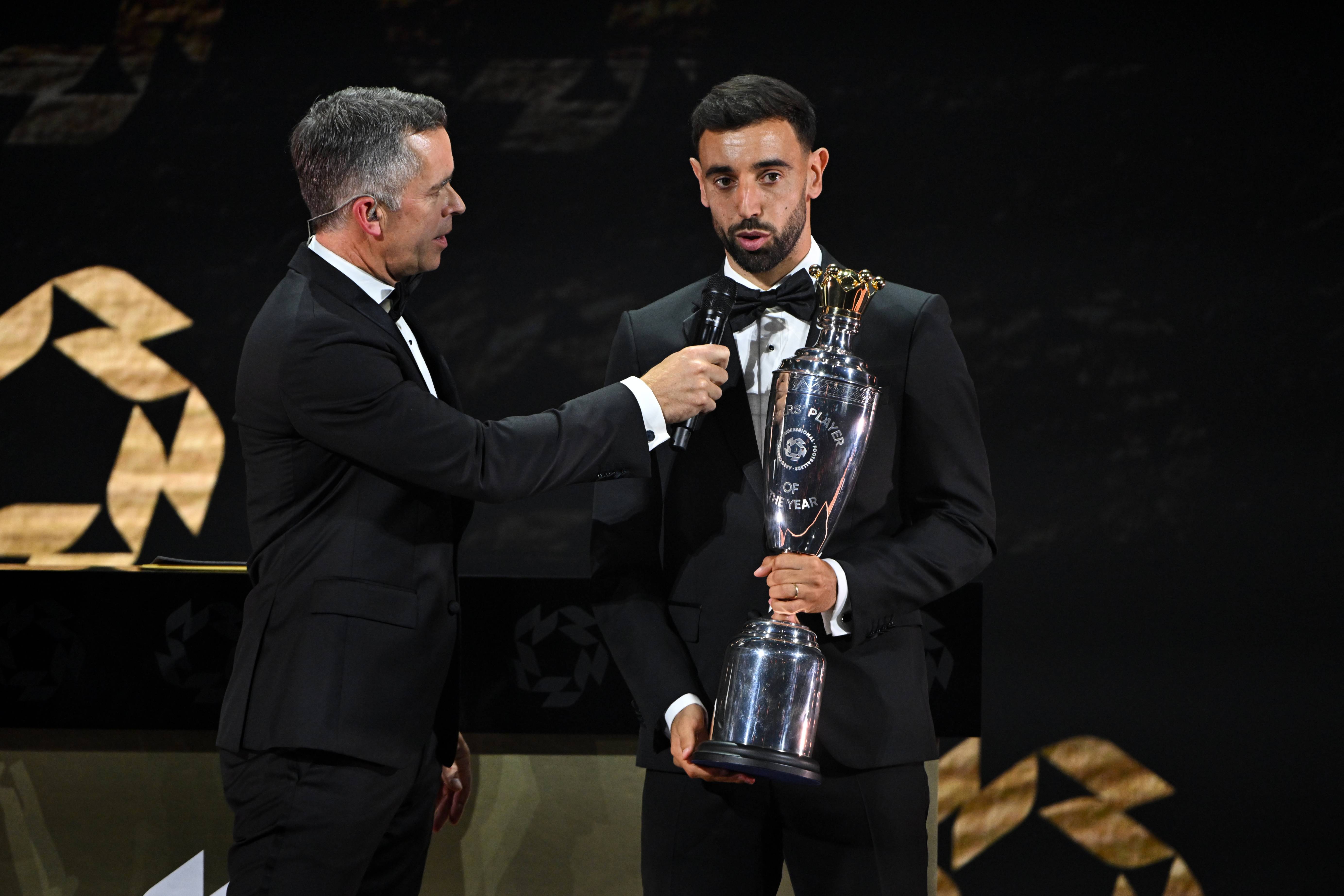 Bruno Fernandes receives the award (Photo by Jeff Spicer/Getty Images) VIA ONE FOOTBALL
